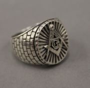 A silver Masonic ring. Ring size W/X.