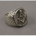A silver Masonic ring. Ring size W/X.