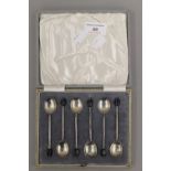 A cased set of silver coffee bean spoons. 51.4 grammes total weight.