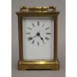 A brass cased carriage clock. 14 cm high.