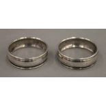 A pair of boxed silver napkin rings. 8 grammes.