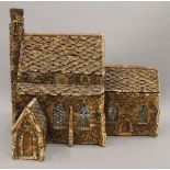 A 19th century cork model of a church. 36 cm long.