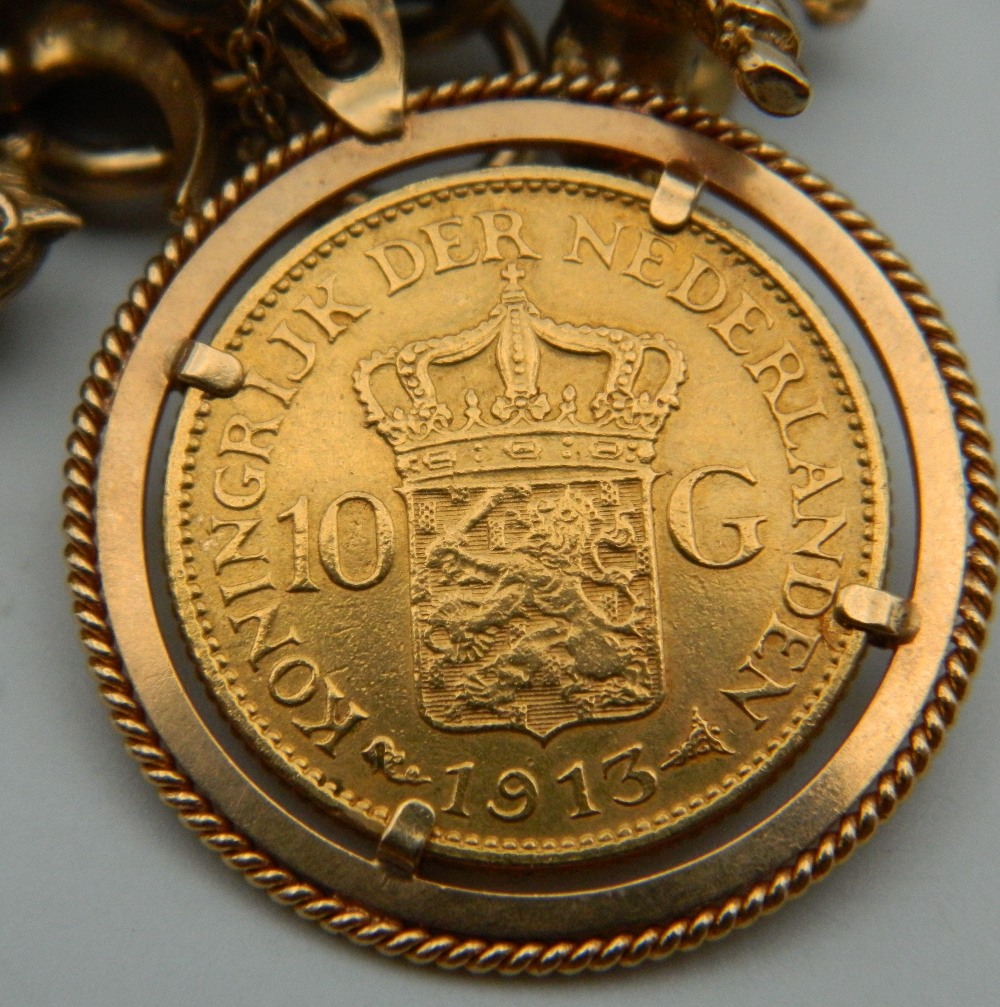 A 9 ct gold charm bracelet, set with various gold coins, including two sovereigns. 218. - Image 8 of 20