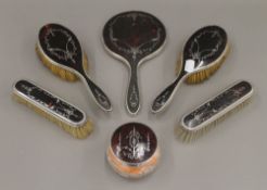 A silver and tortoiseshell dressing table set, hallmarked 1936,