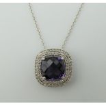 An 18 ct white gold, amethyst and diamond pendant on an 18 ct white gold chain.
