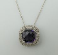 An 18 ct white gold, amethyst and diamond pendant on an 18 ct white gold chain.