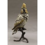 A large cold painted bronze model of a parrot. 30.5 cm high.