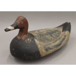 An antique decoy duck. 32.5 cm long.
