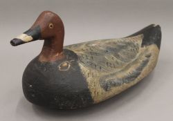 An antique decoy duck. 32.5 cm long.