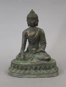 A Chinese bronze model of Buddha. 19 cm high.