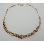 JOHN DONALD (born 1928) British, a 9 ct gold Contemporary necklace. 40 cm long. 28.4 grammes.