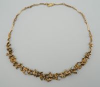 JOHN DONALD (born 1928) British, a 9 ct gold Contemporary necklace. 40 cm long. 28.4 grammes.