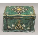 A 19th century faux malachite tea caddy. 18.5 cm wide.