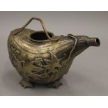 A 19th century bronze pouring vessel formed as a gourd. 18 cm long.