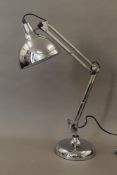 A large chrome anglepoise lamp