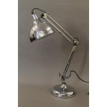 A large chrome anglepoise lamp