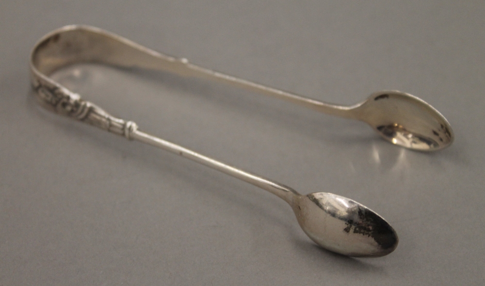 A cased set of silver apostle teaspoons and tongs. 3.2 troy ounces. - Image 8 of 10