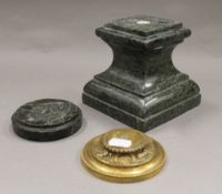 A green marble sculpture base,