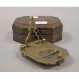 A boxed sundial compass. The boxed 14 cm wide.