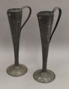 A pair of Art Nouveau pewter vases. 30 cm high.