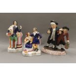 Three Staffordshire figurines; Drunken Parson and Curate, Robert Burns and another.