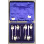 A cased set of silver apostle teaspoons and tongs. 3.2 troy ounces.