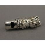 A sterling silver whistle formed as a cat. 4 cm high.