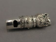 A sterling silver whistle formed as a cat. 4 cm high.