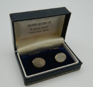A cased pair of silver cufflinks. Each 1.5 cm wide.