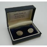 A cased pair of silver cufflinks. Each 1.5 cm wide.