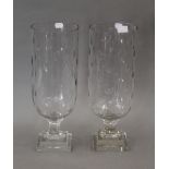 A pair of cut glass storm lamps. 39.5 cm high.