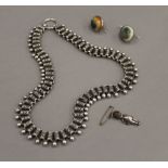 A Victorian silver necklace, a pair of earrings and a silver Fumsup charm. The latter 3 cm high.