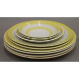 A quantity of T G Green yellow and white porcelain plates. The largest 25 cm diameter.