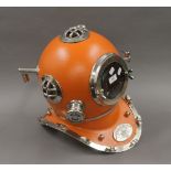 An orange replica divers helmet. 41 cm high.