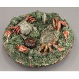 A Mafra Palissy style plate. 25.5 cm diameter.