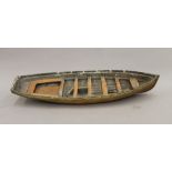 A Scratch Built brass and wooden boat hull. 57 cm long.