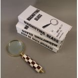 Three boxed magnifying glasses