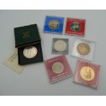 Seven cased medallions and coins