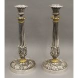 A pair of 19th century gilt heightened silver plated candlesticks. 27 cm high.