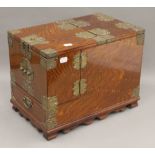 A late 19th/early 20th century Chinese brass mounted 'zebrawood' style gentleman's travelling