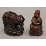 Two 19th century treacle glazed money boxes, one formed as an elephant, 11 cm long.