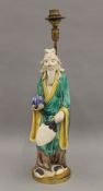 A Chinese pottery figural lamp. 42 cm high overall.