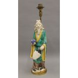 A Chinese pottery figural lamp. 42 cm high overall.