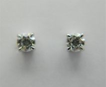 A pair of 18 ct white gold, diamond stud earrings. Total diamond weight approximately 0.