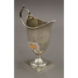 A silver cream jug. 10.5 cm high. 47 grammes.