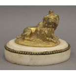 A 19th century gilded bronze figure of a recumbent dog, on a marble plinth base. 11 cm wide.