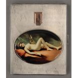 A silver cigarette case depicting a nude lady. 8.5 cm wide.