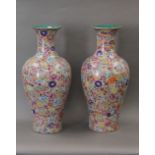A pair of millefiori porcelain vases. 68 cm high.