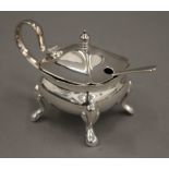 A silver mustard pot and mustard spoon. 75.7 grammes.