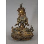 A Chinese gilt bronze model of Buddha set with cabochons. 21 cm high.